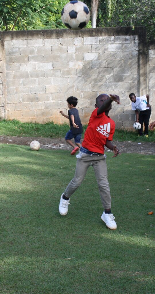boy playing soccer